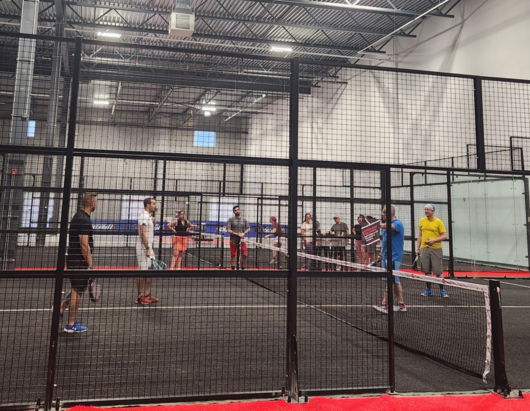 two men playing padel